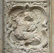 Panel 17:01 - Seated female figure? (quite eroded)